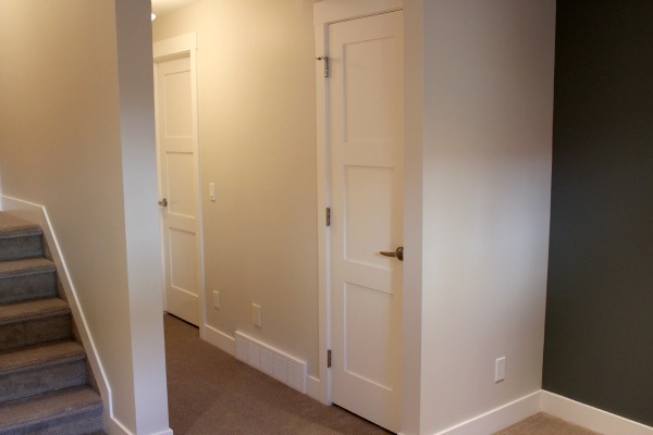 Basement Closet Addition with White Painted Shaker Style Door 