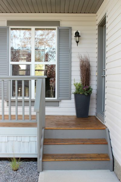 Front Porch Makeover with Grey Shutters and Benjamin Moore Wrought Iron Door - Satori Design for Living