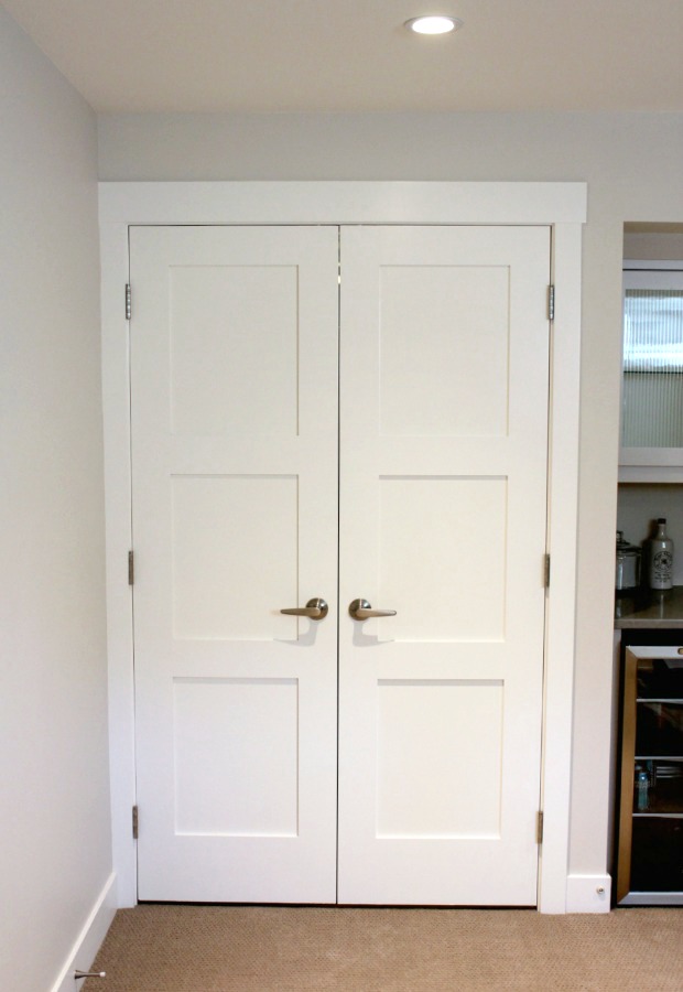 Storage Room Entrance with White Painted Double Shaker Style Doors