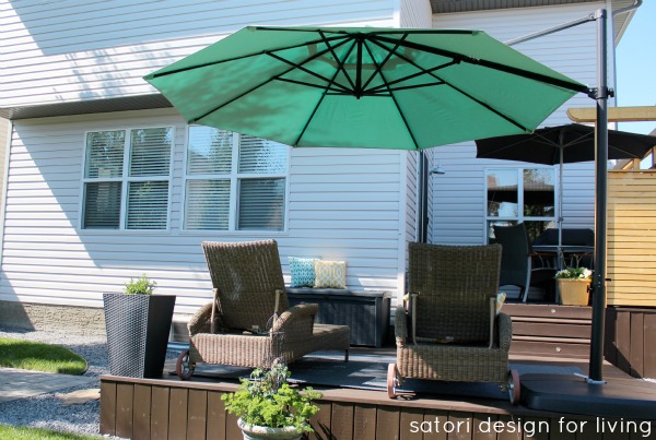 Aqua Offset Umbrella on Dark Brown Deck