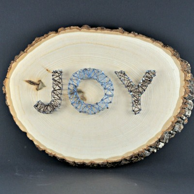 Joy String Art on Log Slice 