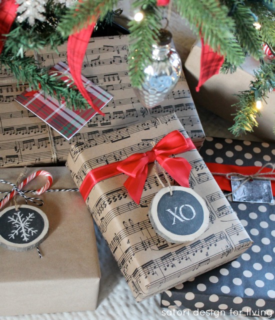 Wrapped Christmas Gifts Under the Tree with Chalkboard Ornaments, Kraft Paper Wrap and Red Ribbon