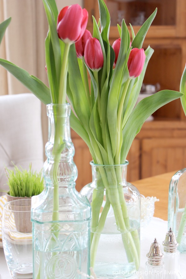 Easter Tablescape with Green Glass Bottles and Spring Tulips