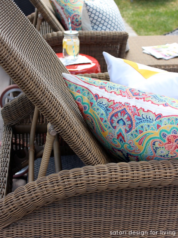 Outdoor Living Space with Wicker Lounge Chairs and Paisley Outdoor Pillows 