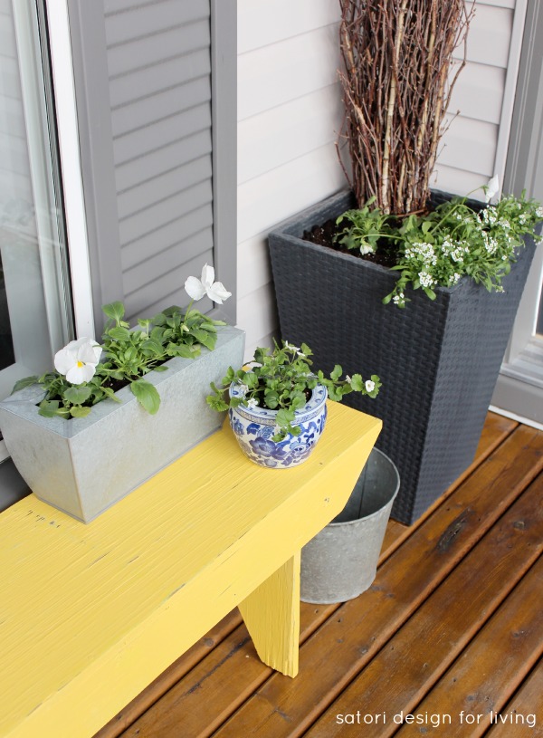 Spring Front Porch with Yellow Bench and Vintage Sap Bucket 