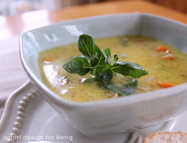 Coconut Curry Chicken Soup in Bowl with Basil Garnish