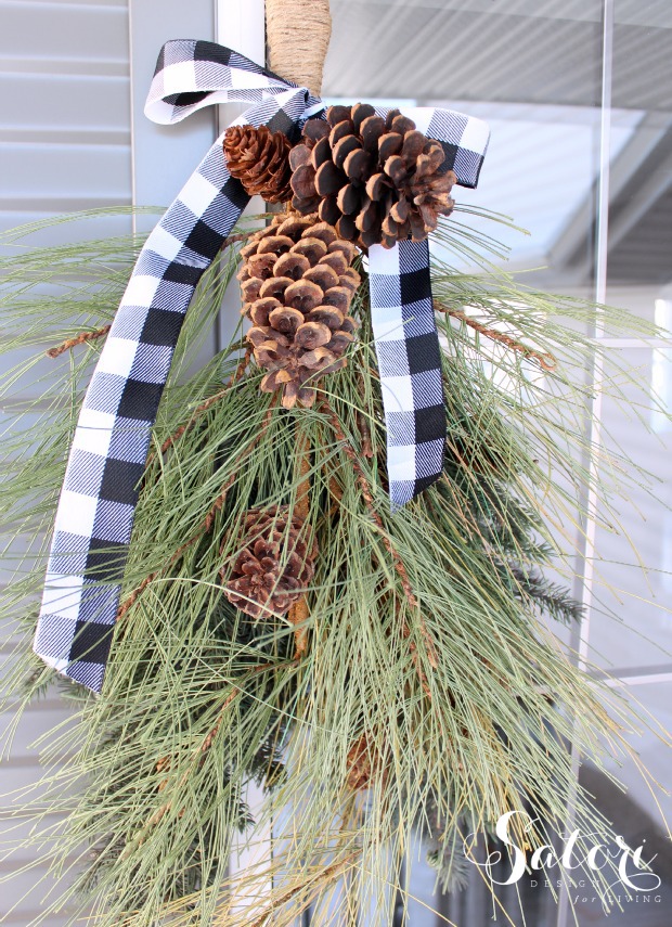 Front Porch Decorated With Winter Swag With Greenery and Pine Cones 