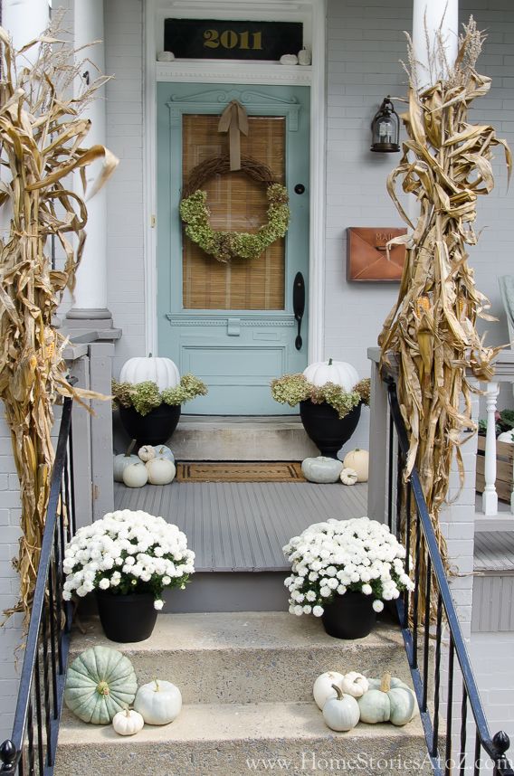 Fall Front Porch Decorated With White Mums and Pumpkins