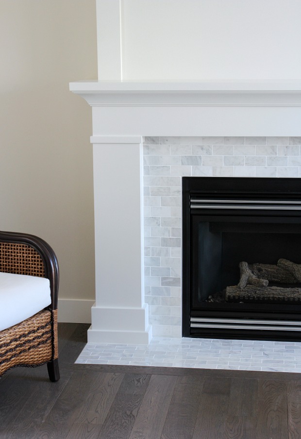 White and Marble Fireplace with White Painted Mantel and Marble Subway Tile Surround 