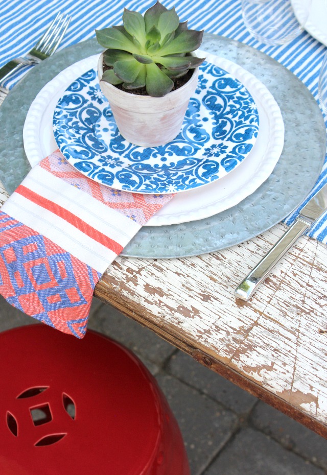 Flea Market Style Outdoor Table Setting With Red Garden Stool and Mini Potted Succulents in Whitewashed Pots