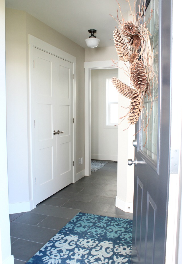 Front Entrance with Charcoal Door and Pine Cone Wreath