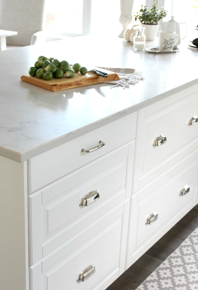 IKEA White Kitchen Island with Polished Nickel Cup Pulls and TCE 4005 Marble Quartz Countertop