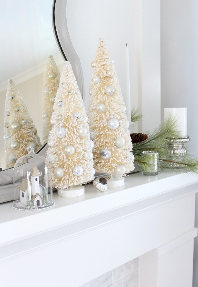 Bottle Brush Trees on White Fireplace Mantel