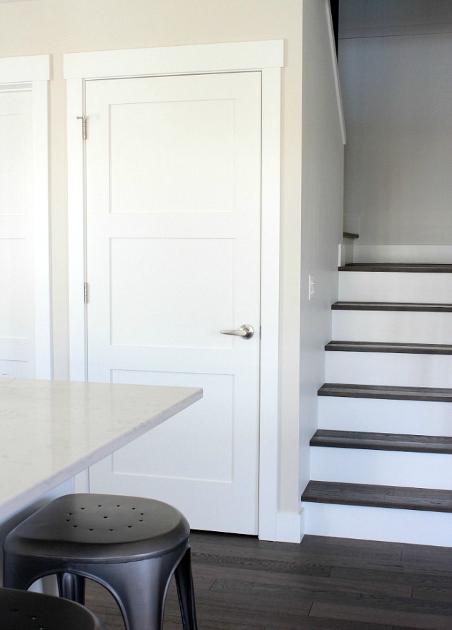 Stairs with White Risers and Dark Treads - Shaker Style White Doors in Kitchen