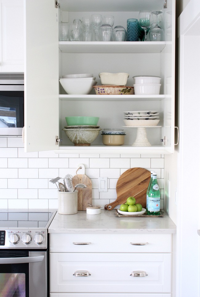 White IKEA Bodbyn Kitchen with Organized Cabinets and Drawers 