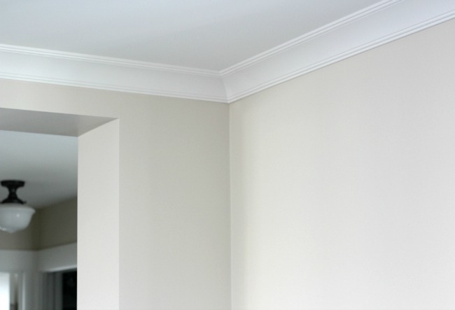 White Crown Moulding in the Living Room with Benjamin Moore Baby Fawn Walls