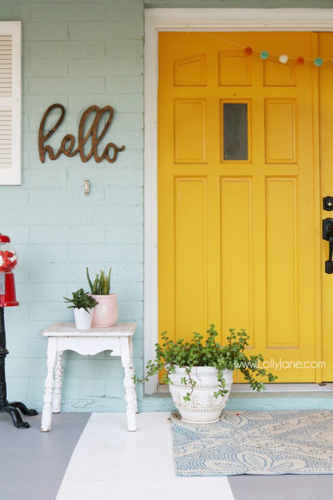 Mustard Front Door Paint with Colorful Front Porch Decor by Lolly Jane - Jackson Square by Valspar