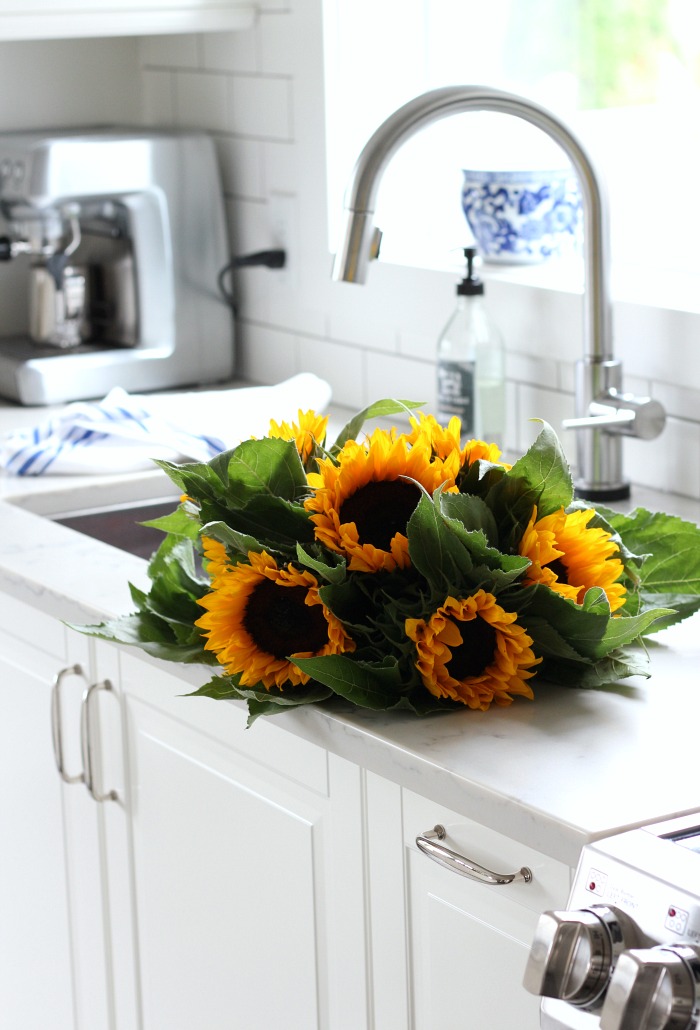 IKEA Kitchen with Bodbyn Off-white Cabinets with White Marble Subway Tile Backsplash 