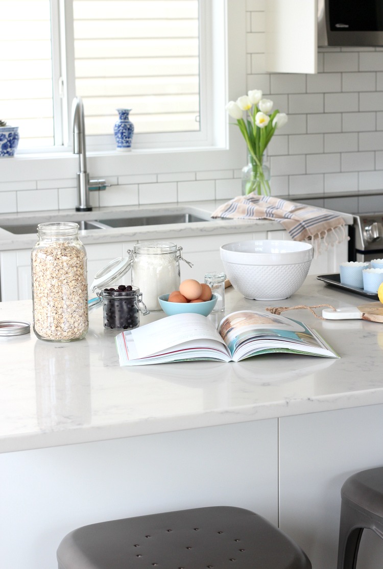 Benjamin Moore White Dove Painted Trim, Doors and Ceiling in the Kitchen with IKEA Bodbyn Off-White Cabinets and Marble Quartz Countertops