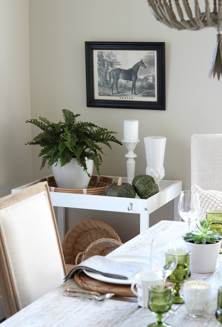 Styled White Cart with Potted Fern and Equestrian Art in Dining Room