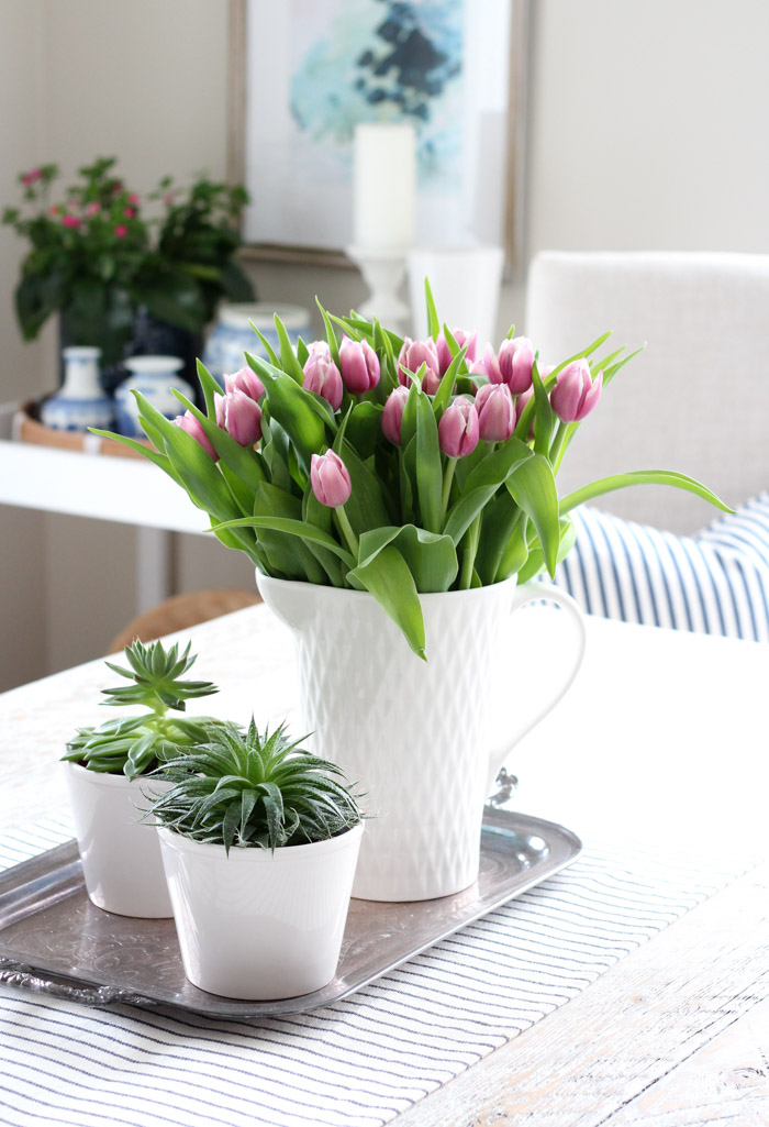 Farmhouse Style Dining Room with Whitewashed Table, Potted Succulents and Tulips