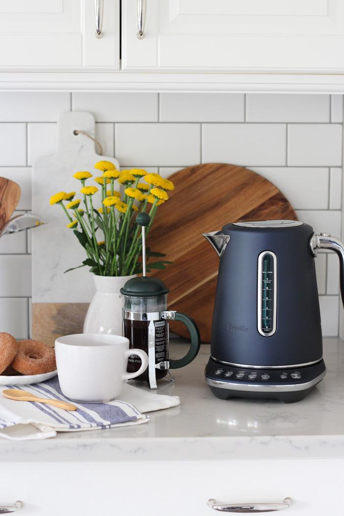 Breville Damson Blue Smart Kettle on White Kitchen Counter with French Press Coffee