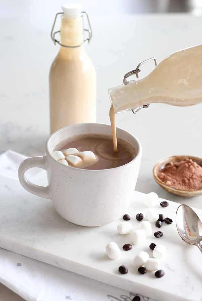 Mocha in White Mug with Toasted Marshmallow Creamer Being Poured In