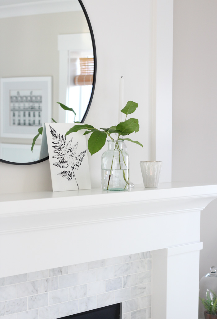 White Fireplace Mantel with Marble Subway Tile Surround