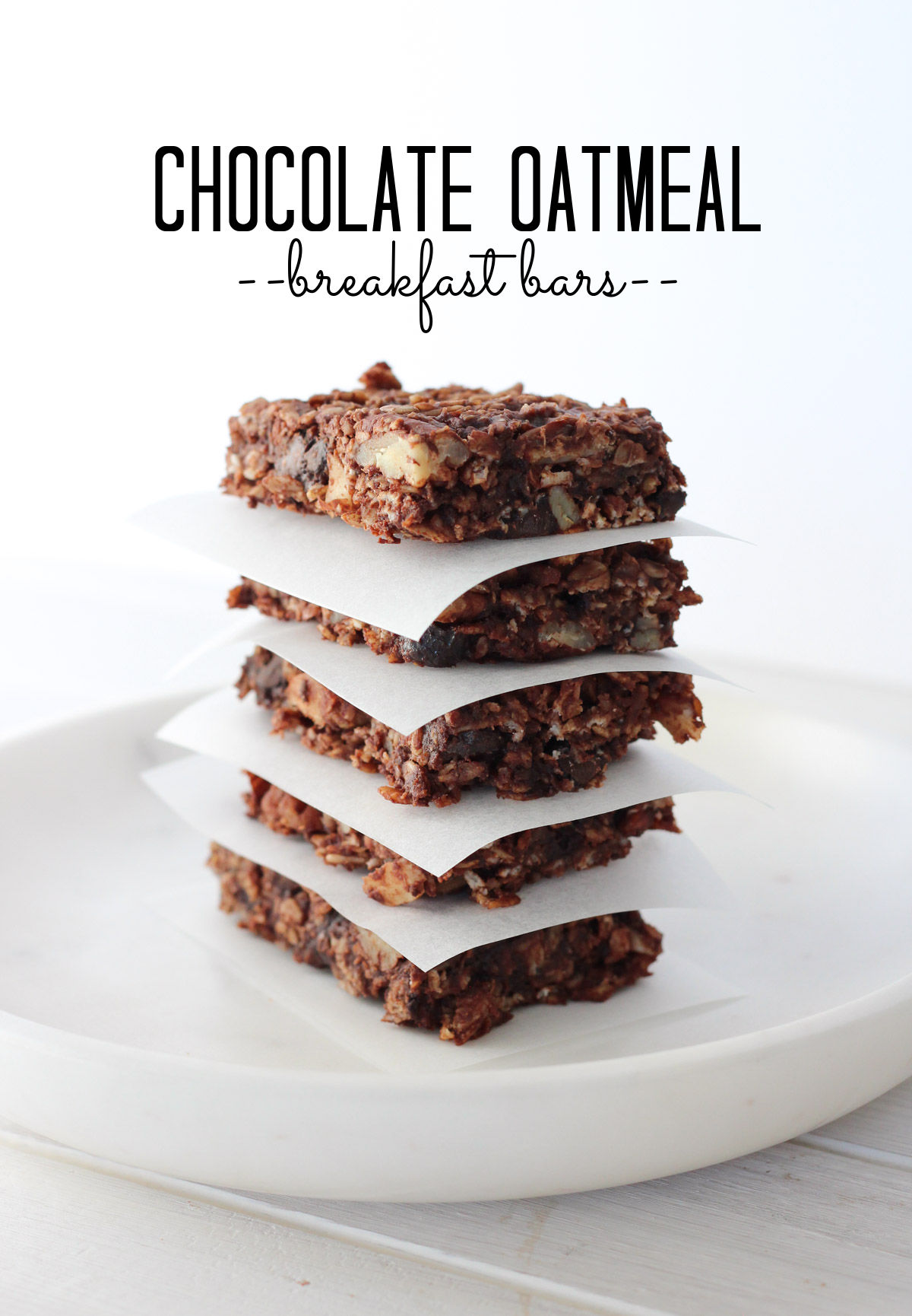 Homemade Chocolate Oatmeal Bars Stacked on White Marble Plate