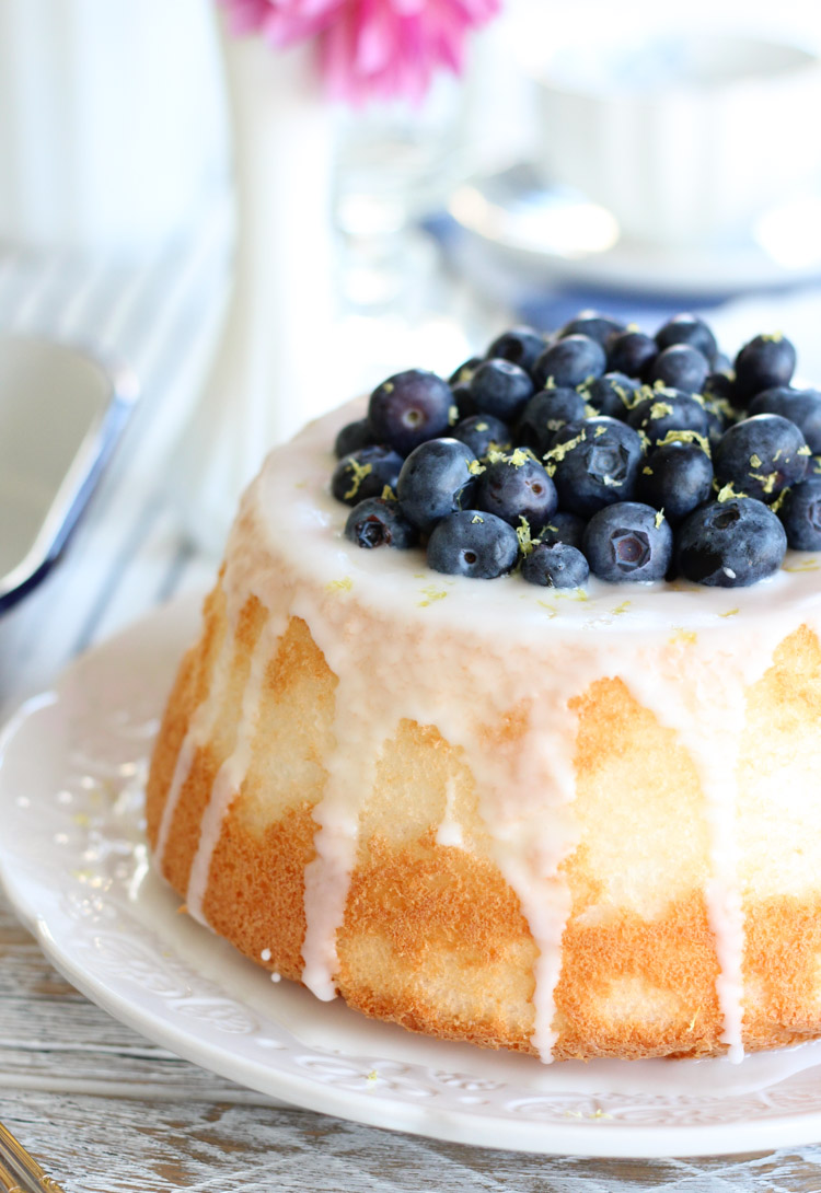 Blueberry Angel Food Cake with Lemon Curd on White Plate