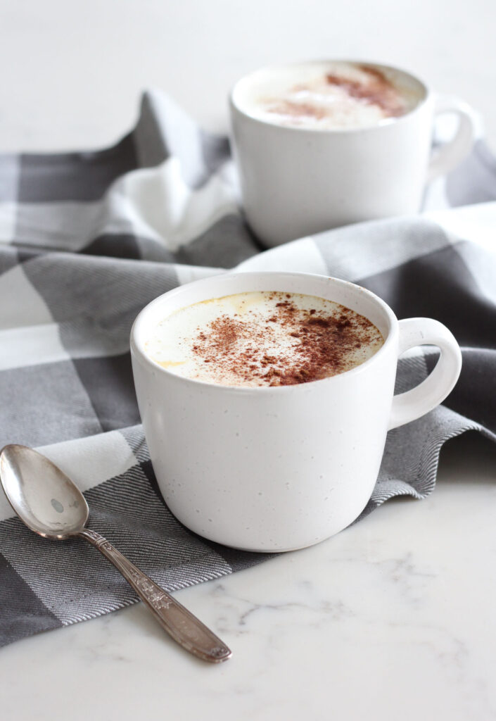 Homemade Latte in White Mug Topped with Cinnamon