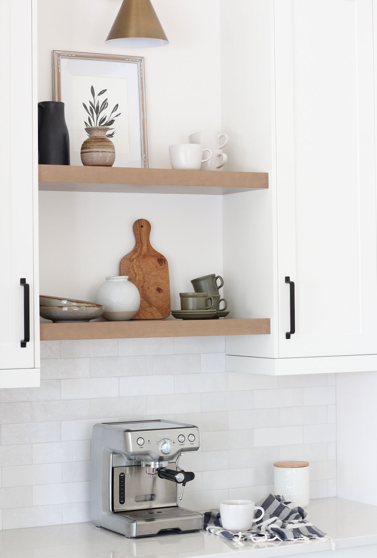 Brass Sconce Above Open Shelving in Kitchen