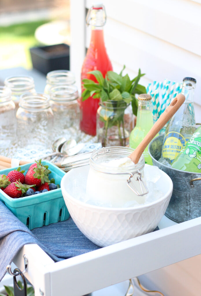 Ice Cream Float Bar on Cart Outside with Jar of Ice Cream, Bottles of Soda, Fresh Mint and More