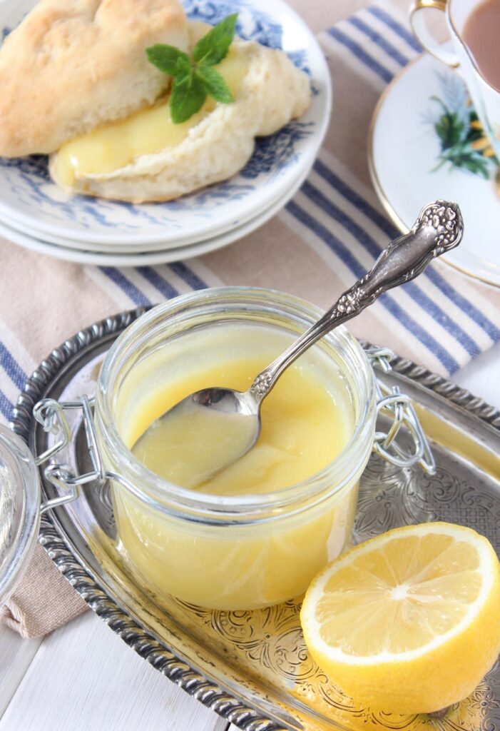 Small Jar of Homemade Lemon Curd on Silver Tray